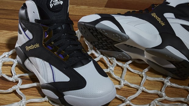 Side view of Shaquille O'Neal's black and white Reebok sneakers.